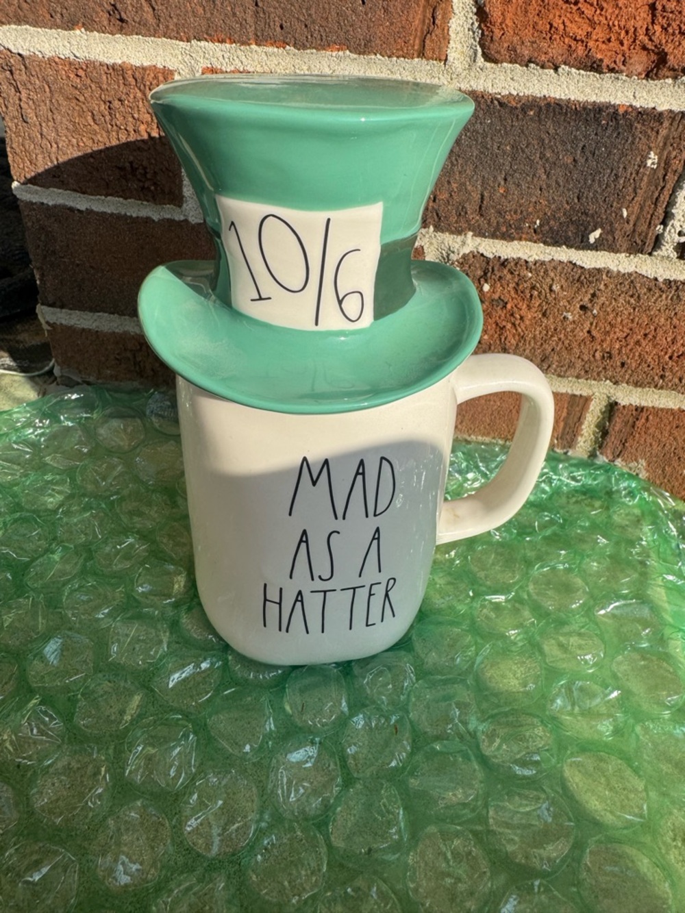 Disney Rae Dunn Mad as a Hatter Ceramic Mug with Mint Green Hat Lid. Never used.